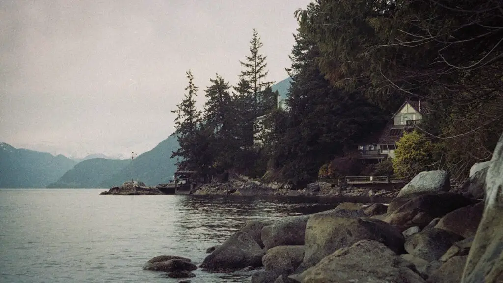A film image of a house on the ocean