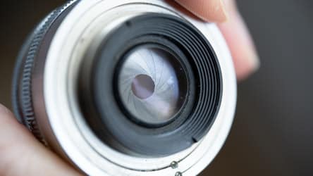 A closed down aperture on an enlarger lens