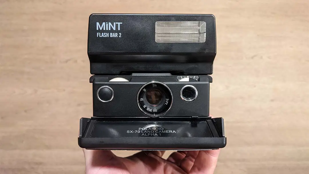 The MiNT Flashbar II on a Polaroid SX-70 camera