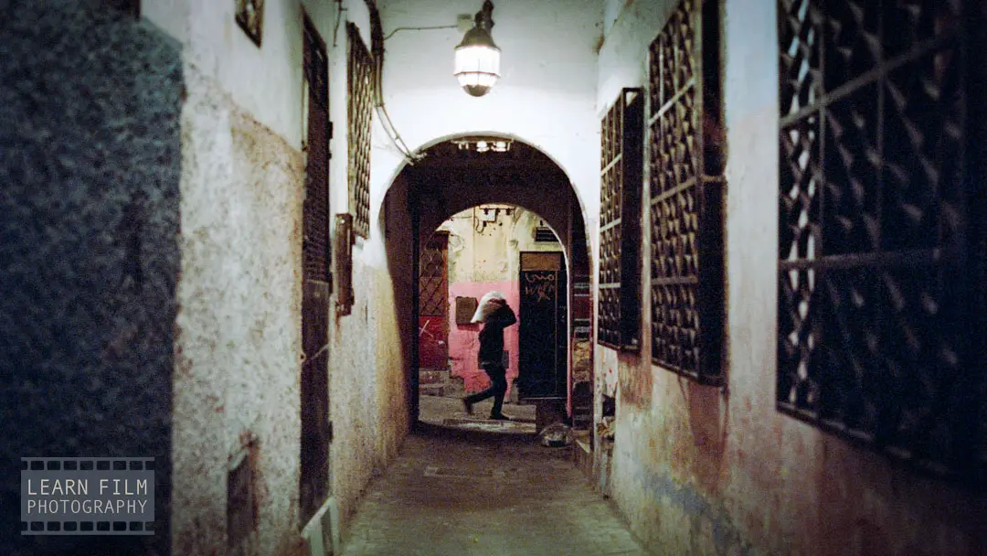 A street photo of a woman passing by in Tangier, Morocco.